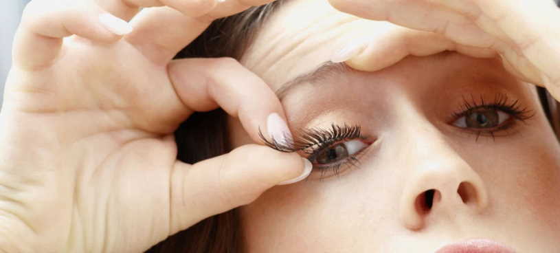applying eyelashes